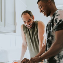 two people cooking in a kitchen